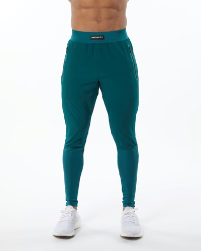 Velvet Teal Alphalete Woven 4-Way Stretch 29" Pant | RTZWXY278